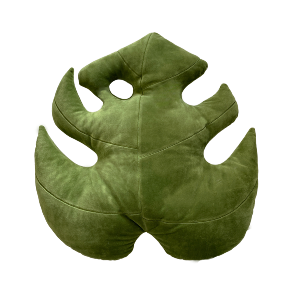 Green leaf-shaped cushion pillow on a white background